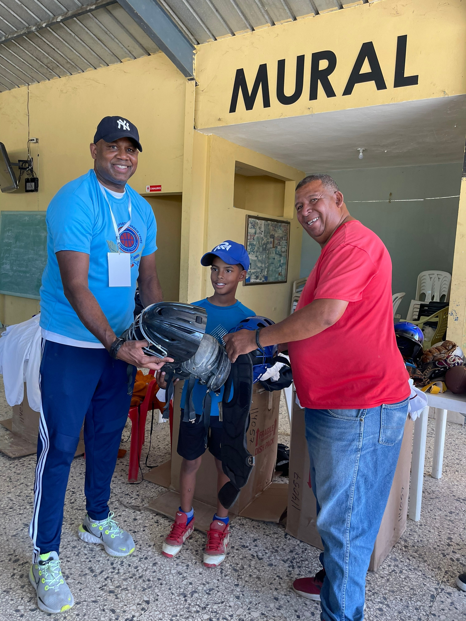 Youth receiving sports equipment through the Play It Forward program